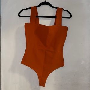 Orange body suit